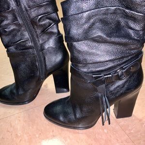 Black heeled ankle booties with tassel